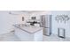Bright open kitchen with stainless appliances and an island at 25324 Aysen Dr, Punta Gorda, FL 33983