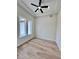 A bright bedroom with a ceiling fan and large windows at 2743 Begonia Ter, North Port, FL 34286