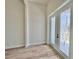 Bright entryway features wood-look floors and decorative glass French doors at 2743 Begonia Ter, North Port, FL 34286
