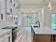 The kitchen island has a marbled top and a stainless steel sink at 2743 Begonia Ter, North Port, FL 34286