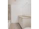 Bathroom features a white vanity with granite countertops, stainless faucet, and updated lighting at 27438 Corinthian Dr, Punta Gorda, FL 33955