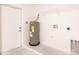 Garage features a water heater, utility hook ups, and door to the house at 27438 Corinthian Dr, Punta Gorda, FL 33955