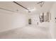 Spacious two car garage with door to inside, water heater, and utility hookups at 27438 Corinthian Dr, Punta Gorda, FL 33955