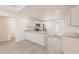 Modern kitchen with granite countertops, stainless appliances, and open access to the entryway at 27438 Corinthian Dr, Punta Gorda, FL 33955