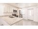 Bright kitchen featuring stainless steel appliances, light wood floors, and a modern countertop at 27438 Corinthian Dr, Punta Gorda, FL 33955