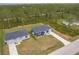 Aerial view of two single-story homes with well-manicured lawns, showcasing the property's curb appeal and landscaping at 27444 Corinthian Dr, Punta Gorda, FL 33955