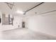 Spacious garage featuring modern mechanical systems, a utility sink, and ample space for parking or storage at 27444 Corinthian Dr, Punta Gorda, FL 33955