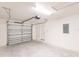 Spacious garage featuring an automatic door opener, ample space for parking and storage, and white walls at 27444 Corinthian Dr, Punta Gorda, FL 33955