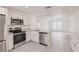 Modern kitchen featuring stainless steel appliances and granite countertops at 27444 Corinthian Dr, Punta Gorda, FL 33955