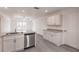Modern kitchen featuring stainless steel appliances and granite countertops at 27444 Corinthian Dr, Punta Gorda, FL 33955