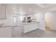 Bright kitchen featuring stainless steel appliances, granite countertops, white cabinets and gray floors at 27456 Corinthian Dr, Punta Gorda, FL 33955