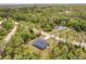 A view of the neighborhood with lots of trees at 28218 N Twin Lakes Dr, Punta Gorda, FL 33955