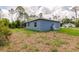 Side view of the backyard of this home and some trees at 28218 N Twin Lakes Dr, Punta Gorda, FL 33955