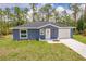 Charming single-Gathering home with a well-maintained lawn and a concrete driveway at 28218 N Twin Lakes Dr, Punta Gorda, FL 33955