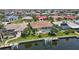 This canal-front home features a screened-in pool and private dock, ideal for enjoying waterfront living at 2833 La Mancha Ct, Punta Gorda, FL 33950