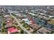 Aerial view of the waterfront property with its prime location on the canal, surrounded by lush landscaping at 2833 La Mancha Ct, Punta Gorda, FL 33950