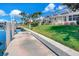 Dock in a lovely canal front backyard and well-maintained lawn at 2833 La Mancha Ct, Punta Gorda, FL 33950