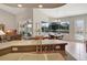 Open kitchen featuring a breakfast bar, stainless steel appliances, and views of the lanai at 2833 La Mancha Ct, Punta Gorda, FL 33950