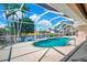 Inviting screened-in pool with lush canal view and relaxing outdoor space at 2833 La Mancha Ct, Punta Gorda, FL 33950