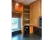 Corner kitchen cabinet with lazy susan, wooden finish, and a view from the window at 3027 Ridgewood Dr, North Port, FL 34287