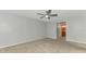 This main bedroom features carpet flooring, neutral paint, and a ceiling fan at 3027 Ridgewood Dr, North Port, FL 34287