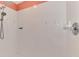 Bright shower featuring white tiled walls, and orange trim at 3027 Ridgewood Dr, North Port, FL 34287