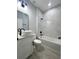 Bathroom featuring a tub with marble tile, granite countertops, and black fixtures at 3045 Montgomery Dr, Port Charlotte, FL 33981