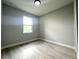 Bedroom with a light gray paint and light gray wood-look flooring at 3045 Montgomery Dr, Port Charlotte, FL 33981