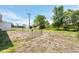 Expansive backyard with trees and potential for gardening or outdoor activities at 330 Lasayette Ne Dr, Port Charlotte, FL 33952