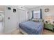 Inviting bedroom with bright natural light, comfortable queen bed, and painted green bed frame at 330 Lasayette Ne Dr, Port Charlotte, FL 33952