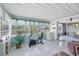Bright Florida room with tiled floors and access to the backyard through sliding glass doors at 330 Lasayette Ne Dr, Port Charlotte, FL 33952