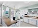 Functional kitchen with white appliances and a cozy breakfast bar at 330 Lasayette Ne Dr, Port Charlotte, FL 33952