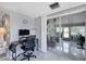 A home office area next to a screened in porch at 330 Lasayette Ne Dr, Port Charlotte, FL 33952