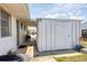 Exterior view of a shed with a concrete patio and walkway, attached to the home at 330 Lasayette Ne Dr, Port Charlotte, FL 33952