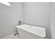 Freestanding tub with modern faucet and marble floors at 3380 Elkcam Blvd, Port Charlotte, FL 33952