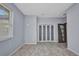 Vacant room with LVP flooring, a window and double closet at 3380 Elkcam Blvd, Port Charlotte, FL 33952
