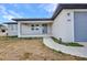 Charming single-story home featuring a new driveway and attached one car garage at 3380 Elkcam Blvd, Port Charlotte, FL 33952