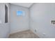 Utility room with luxury vinyl plank flooring and hook ups for laundry machines at 3380 Elkcam Blvd, Port Charlotte, FL 33952