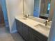 This modern bathroom features double sinks, quartz counters, and modern fixtures at 3560 Elias Cir, North Port, FL 34288