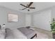 This bedroom features a ceiling fan, closet, and a neutral color palette, creating a serene retreat at 3560 Elias Cir, North Port, FL 34288