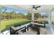 A screened-in patio offers a relaxed outdoor living space with views of the lush backyard, perfect for entertaining at 3560 Elias Cir, North Port, FL 34288