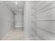 Spacious walk-in closet with multiple shelves, providing ample storage and organization space at 3560 Elias Cir, North Port, FL 34288
