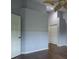 Well-lit bedroom with wood floors, ceiling fan and a large closet for storage at 3702 Lakewood Blvd, North Port, FL 34287