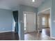 Welcoming foyer area leading to a living room with screened-in lanai access at 3702 Lakewood Blvd, North Port, FL 34287