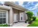 Inviting front entrance with well-maintained landscaping and neutral exterior paint color at 3702 Lakewood Blvd, North Port, FL 34287