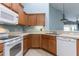 Kitchen area with wooden cabinets and stainless steel appliances at 3702 Lakewood Blvd, North Port, FL 34287