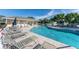 Community pool with ample seating, perfect for relaxation and recreation at 3702 Lakewood Blvd, North Port, FL 34287