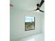 Bright bedroom with large window, ceiling fan, and white marble floors at 3920 Wisteria Pl, Punta Gorda, FL 33950