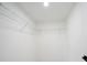 Walk-in closet has ample storage space with wire shelving and neutral walls at 3920 Wisteria Pl, Punta Gorda, FL 33950