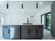 Modern kitchen island with a stainless steel dishwasher and a stylish faucet at 3920 Wisteria Pl, Punta Gorda, FL 33950
